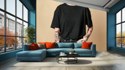 Cool tattooed woman in black clothes Wall mural