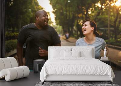 Couple having fun together at the park Wall mural