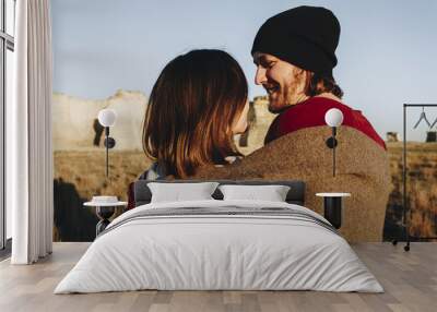 Couple hiking together in the wilderness Wall mural