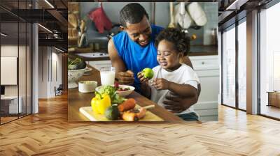 Dad and son cooking together Wall mural