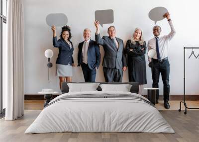 Diverse business team holding speech bubbles Wall mural