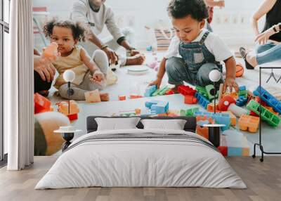 Diverse children enjoying playing with toys Wall mural