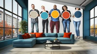 Diverse people holding blank round board Wall mural