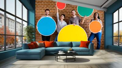 Diverse people holding colorful round boards Wall mural