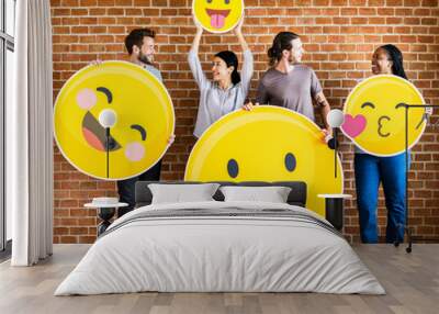 Diverse people holding positive emoticons Wall mural