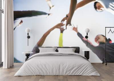 Diverse people joined hands together Wall mural