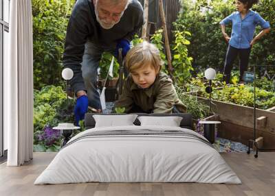 family planting vegetable from backyard garden Wall mural