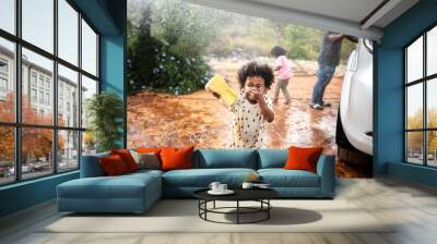 Family washing their white car Wall mural