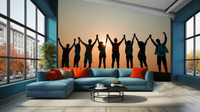 Friends holding hands at sunset Wall mural