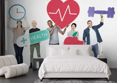 Group of diverse people holding health and fitness icons Wall mural