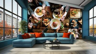 Group of friends eating together Wall mural