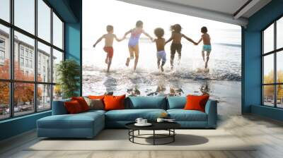 Group of kids enjoying their time at the beach Wall mural