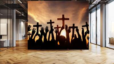 Group of People Holding Cross and Praying in Back Lit Wall mural