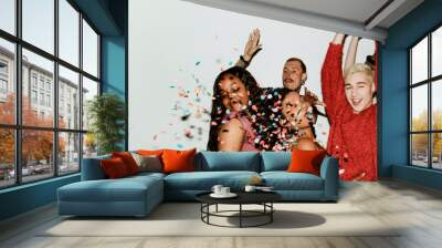 Hands in the air while dancing on the dance floor at a party Wall mural