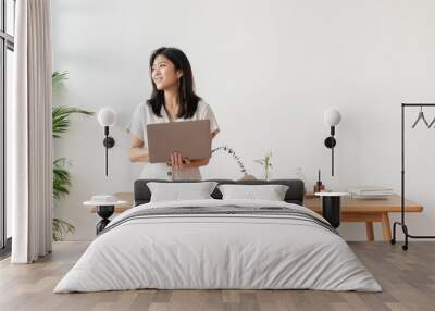 Happy Asian woman working from home Wall mural