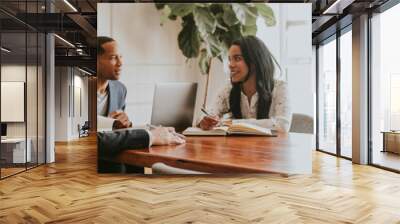 Happy business people talking at a meeting Wall mural