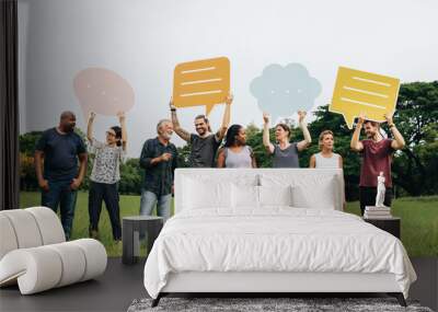 Happy diverse people holding colorful speech bubbles Wall mural