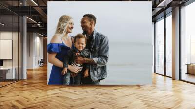 Happy family at the beach Wall mural