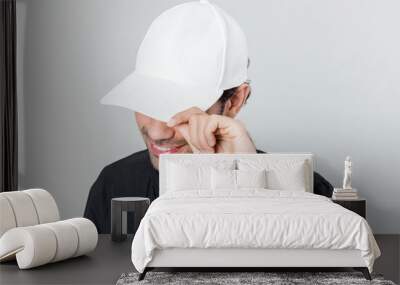 Happy man wearing a white cap Wall mural