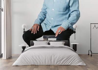 Happy retired man sitting on a stool Wall mural