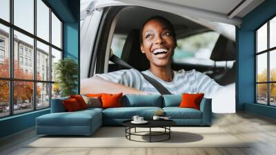 Happy woman driving a car Wall mural