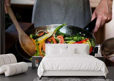 Japanese woman cooking stir fried vegetables Wall mural