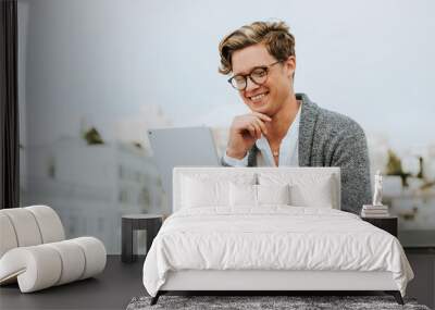 Man using a digital tablet at a rooftop in San Francisco Wall mural