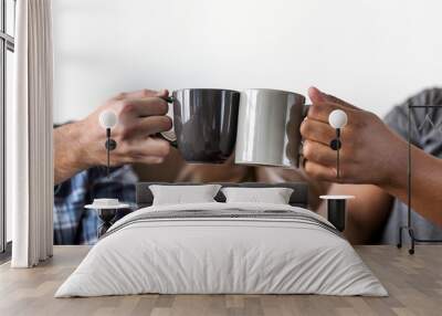 men toasting coffee cup together Wall mural