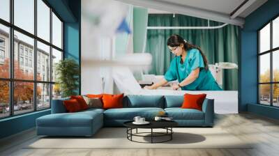 Nurse making the bed at a hospital Wall mural