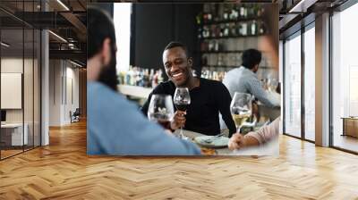 People having meal together in a restaurant Wall mural