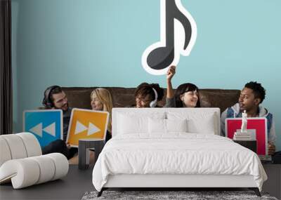 People holding media player icons and a musical note Wall mural