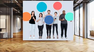 People using their phones holding empty circles Wall mural