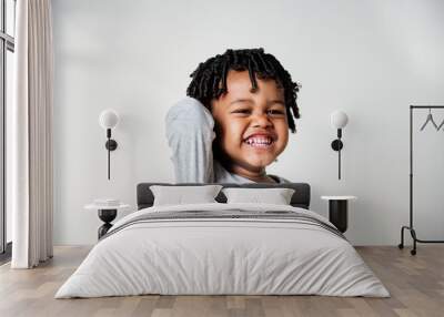 Portriat of young cheerful black boy Wall mural