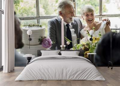 Senior Caucasian Couple Sitting Together Cheerful Wall mural