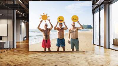 Senior friends having fun at the beach Wall mural