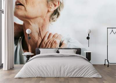 Senior woman having shoulder pain Wall mural