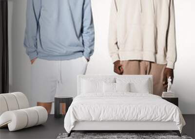 Teenage boys in blue sweater and beige for streetwear apparel shoot Wall mural