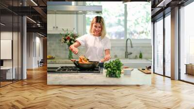 Woman cooking in the kitchen Wall mural