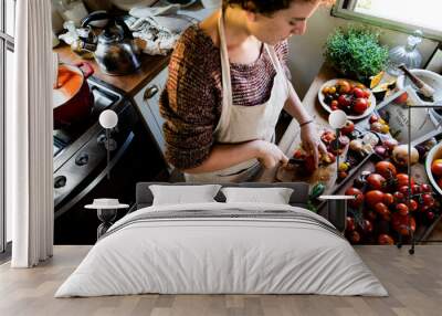 woman slicing tomatoes for pasta sauce Wall mural