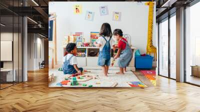 Young children enjoying in the playroom Wall mural