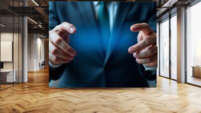 A businessman interacts with a glowing blue virtual interface, highlighting digital transformation Wall mural