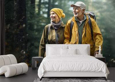 elderly couple hiking in the woods Wall mural