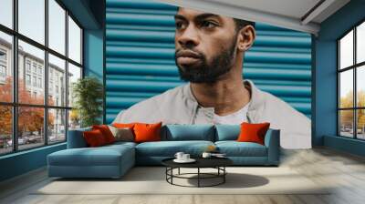 Good looking young black man in trendy fashion urban street clothes looking stylish, trendy and urban Wall mural