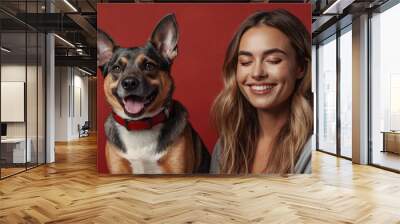 Dog and woman portrait on red background isolated. Pets and companions. Commercial banner for advertising cat and dog food. Pets looking at the camera on red background. Wallpaper. Copy space Wall mural