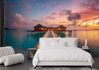 amazing sunset panorama at maldives luxury resort pier pathway soft led lights into paradise island beautiful evening sky and colorful clouds romantic beach background for honeymoon vacation Wall mural