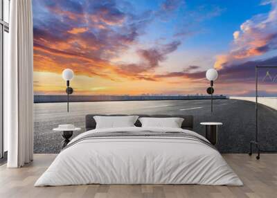 asphalt road and skyline with colorful sky clouds at sunset Wall mural