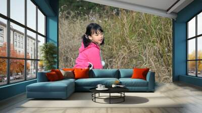 Asian girl playing Wall mural