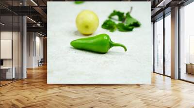 Green Chilli with lemon and mint leaves Wall mural