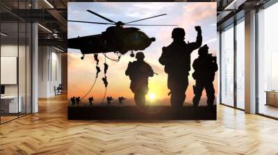 silhouette  of military operation at sunset Wall mural