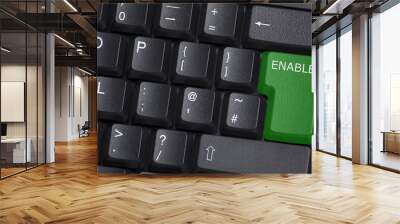 A green ENABLE button on computer keyboard Wall mural